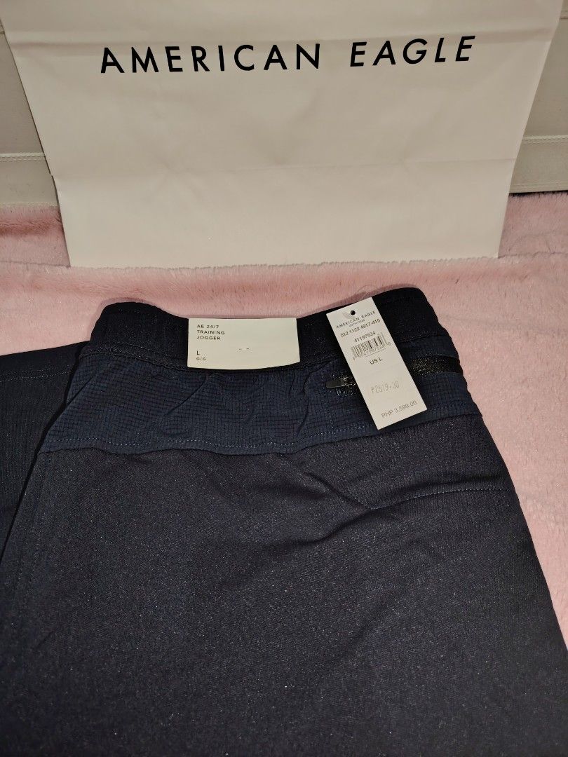 American Eagle Men's Pants (Category: Jeans) located in Taguig. Submitted by rtk06 (Listing ID 1431958417, Image 3). Description: American Eagle men's pants. One pair is navy blue with a drawstring and the other is olive green with a belt. Both pairs have tags attached. The navy blue pair has a size L tag. The olive green pair has a size XL. Item comes with paper bag. Feel free to message me for more info. .