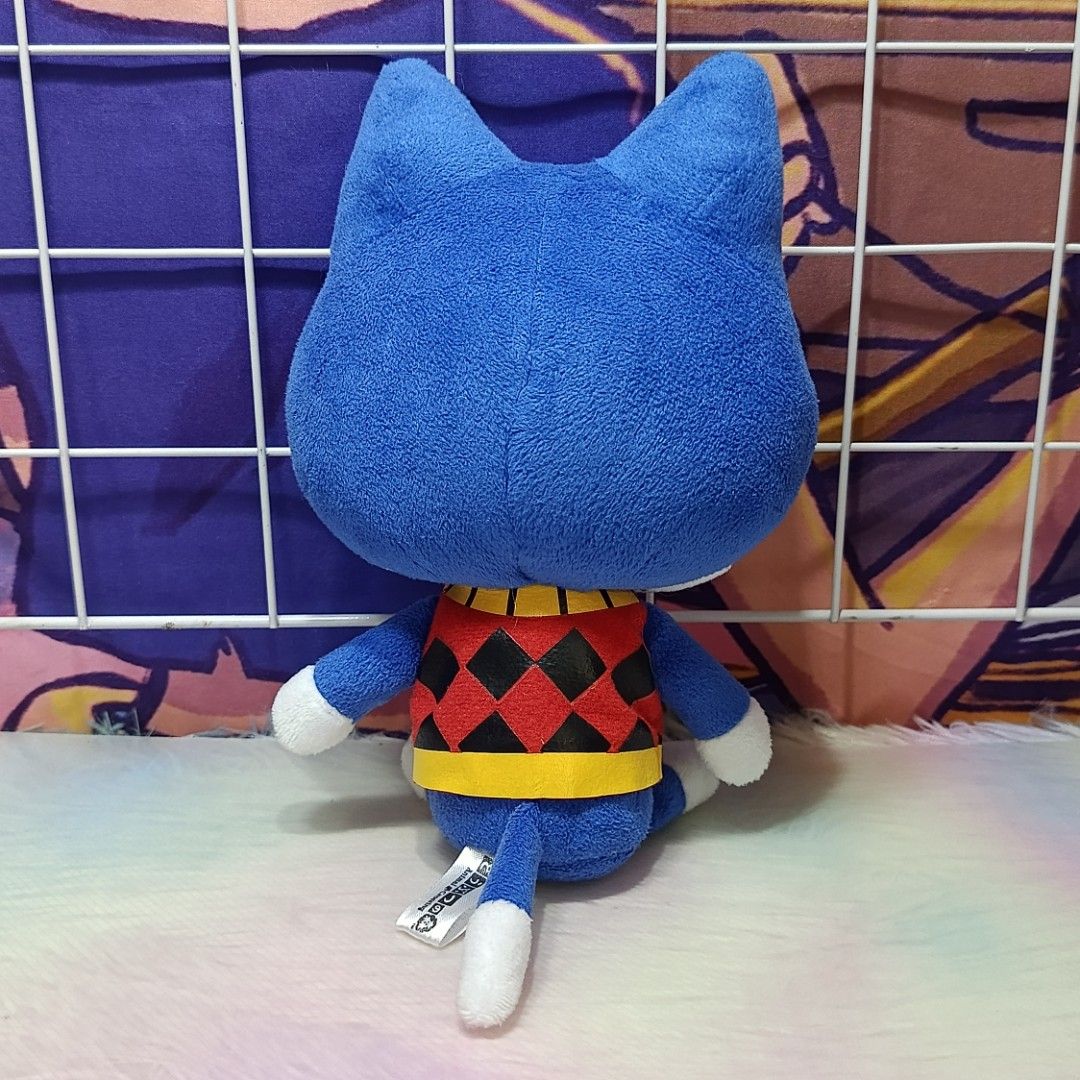 Animal Crossing Rover Plush Toy (Category: Plushies & Soft Toys) located in Paranaque City. Submitted by niropa (Listing ID 1431804002, Image 2). Description: - Adorable Rover plush toy from Animal Crossing. - Features a blue cat design. - Includes a red and black diamond pattern shirt. - Comes with a yellow collar and white paws. - Made by San-Ei Co., Ltd. - Officially licensed by Nintendo. - Includes the original tag..