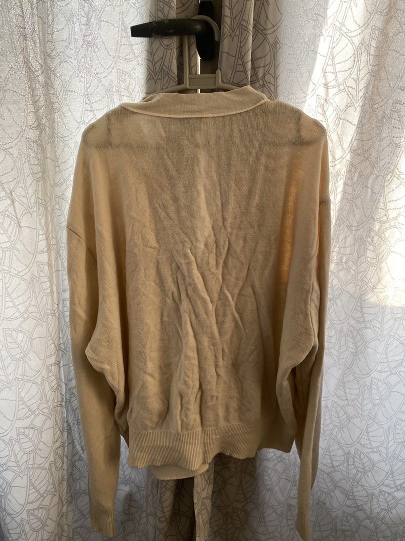 AQO Studio Space Cream Cardigan (Category: Coats, Jackets and Outerwear) located in Manila. Submitted by lomlberries (Listing ID 1431893580, Image 3). Description: - Cream-colored cardigan from AQO Studio Space - Features a bear logo on the chest - Two front pockets - Button-up closure with an orange button - Size: F - Condition: Good.