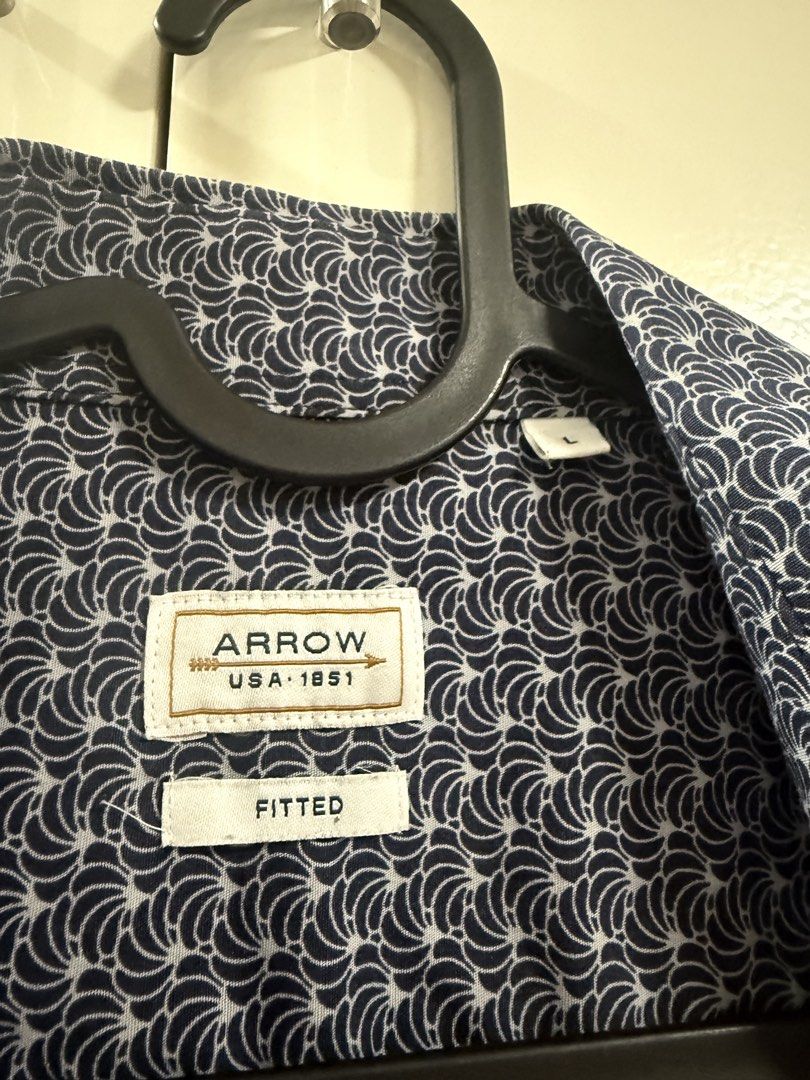Arrow USA 1851 Fitted Shirt (Category: Formal Shirts) located in Bulacan. Submitted by hbpreloveditems (Listing ID 1431830372, Image 2). Description: - Arrow USA 1851 fitted shirt - Navy blue pattern with white accents - Short sleeves - Button-down front - Features a collar - Comfortable fit - Ideal for casual or smart-casual outfits.
