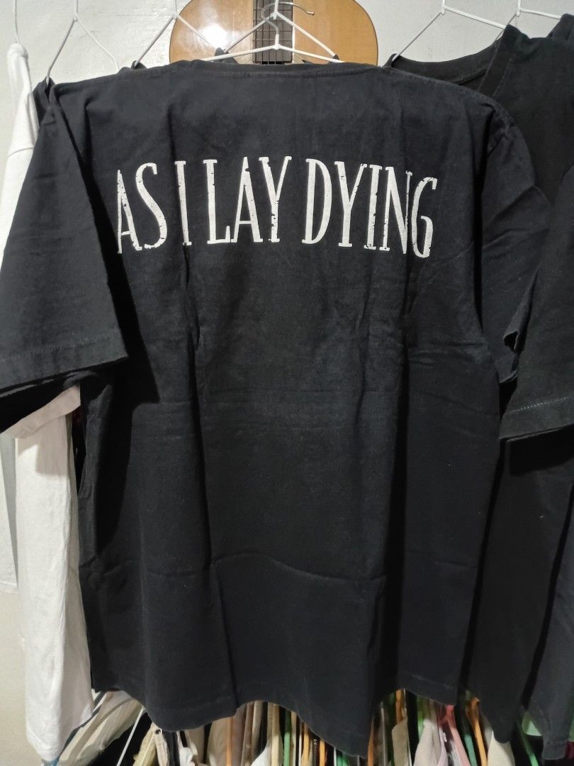 As I Lay Dying Black T-Shirt (Category: Tshirts & Polo Shirts ) located in Quezon City. Submitted by reddcluttermnl (Listing ID 1431885165, Image 2). Description: - Black As I Lay Dying t-shirt - Band name printed on the back - Features a turquoise design on the front - Made of a cotton blend - Large on tag.