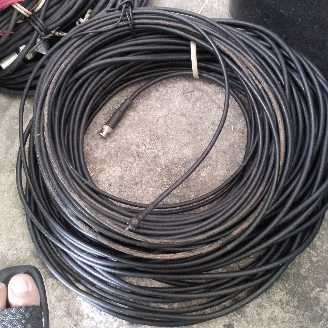 Assorted Cables and Power Strip (Category: Cables & Adaptors) located in Pateros City. Submitted by valezajoakkergor004 (Listing ID 1431855089, Image 3). Description: - Assorted cables for various uses. - Includes power cables, BNC cables, and XLR cables. - Comes with a multi-outlet power strip. - Cables in different lengths and colors. - Some cables are bundled with ties. - Ideal for audio, video, and general electrical applications..
