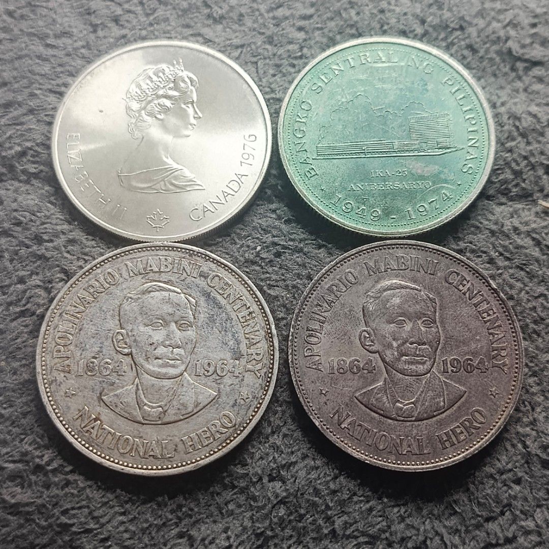 Assorted Silver Commemorative Coins (Category: Currency) located in Quezon City. Submitted by Coiners (Listing ID 1431994108, Image 1). Description: - Commemorative coin collection. - Includes: - 1976 Canada coin - 1974 Philippine coin - Two 1964 Apolinario Mabini Centenary coins - 1976 Montreal Olympics coin - Two Philippine One Peso coins - Features various designs and inscriptions. - Showcases historical figures and events. - Ideal for coin co