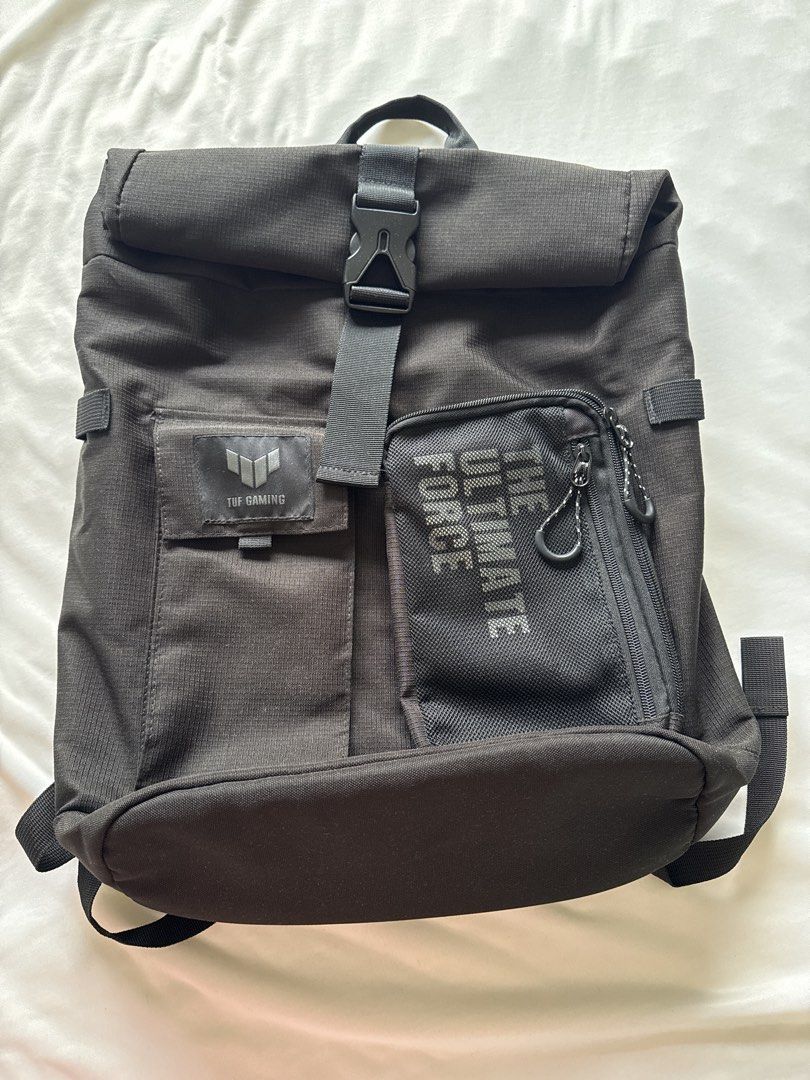ASUS TUF Gaming Backpack (Category: Backpacks) located in Santa Cruz. Submitted by liacong (Listing ID 1431817257, Image 1). Description: - ASUS TUF Gaming Backpack - Roll-top closure - Front pocket with ASUS TUF Gaming logo - Smaller zippered pocket with "THE ULTIMATE FORCE" text - Padded, adjustable shoulder straps - Top handle for carrying Brand New price is P2400 RFS: Decluttering Nakatabi lang hindi nagagamit.