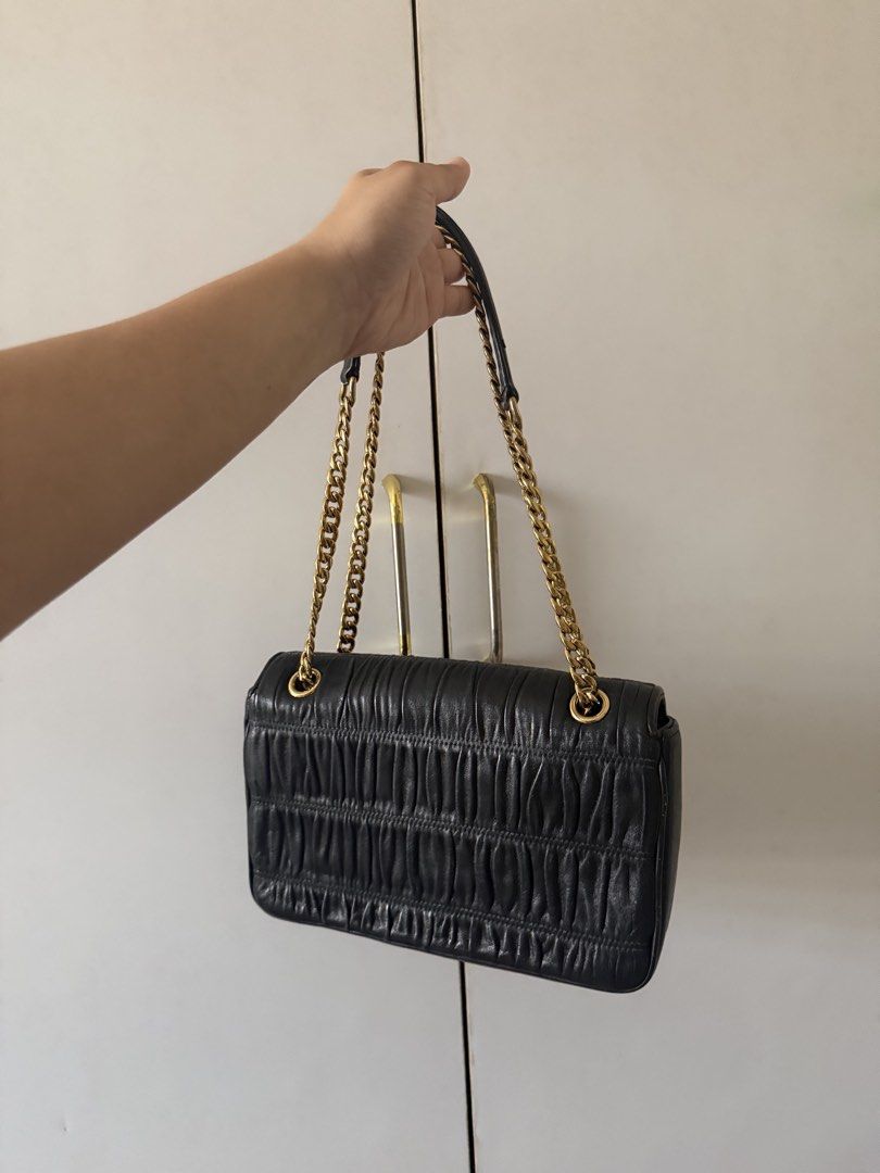 AUTHENTIC PRADA - black Prada Nappa Gauffre leather chain (Category: Luxury Bags & Wallets) located in Taguig. Submitted by vintagesoul888 (Listing ID 1431831411, Image 2). Description: PRADA handbag / shoulder bag black leather Minor flaws on the side Unique / limited design from Prada Authentic Rfs: decluttering.