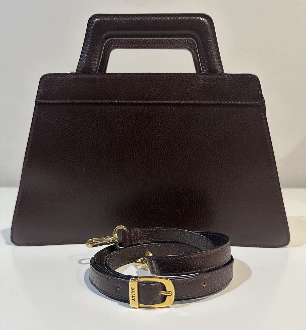 Bally Brown Leather Handbag with Shoulder Strap (Category: Luxury Bags & Wallets) located in Manila. Submitted by caseller26 (Listing ID 1431964679, Image 2). Description: - Bally handbag in brown - Top handle and detachable shoulder strap - Gold-tone buckle and hardware - Bally logo detail - Classic and versatile design - Made in Italy - With dust bag.