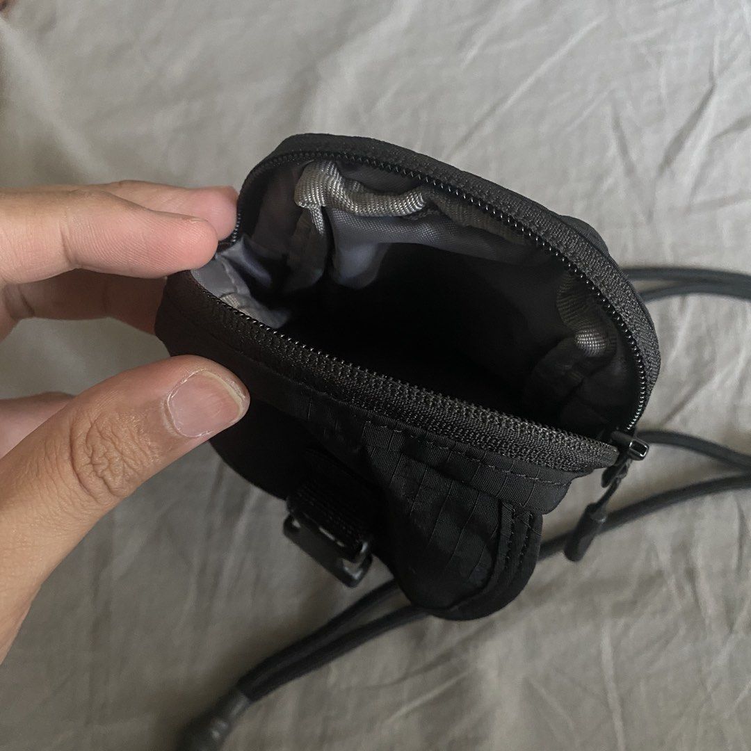 Uniqlo Black Neck Pouch (Category: Belt bags, Clutches and Pouches) located in Makati City. Submitted by hyperdrive_mnl (Listing ID 1431825407, Image 3). Description: - Black neck pouch - Secure buckle closure - Adjustable neck strap - Main compartment - Inner pocket - Holds phone, cards, and keys - Sleek, minimalist design - Perfect for everyday use Location: Near Circuit Makati.