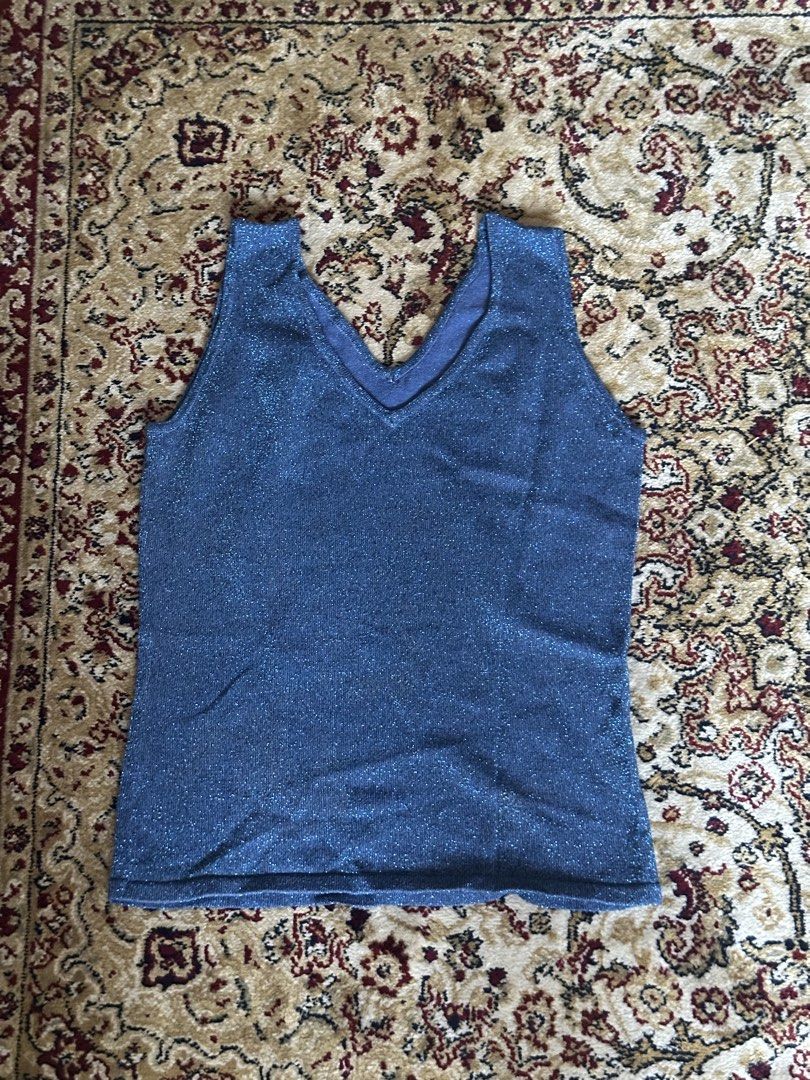 Blue Sparkly Tank Top XS/S (Category: Sleeveless) located in Quezon City. Submitted by guancialebaby (Listing ID 1431894394, Image 1). Description: - never worn! - Shimmering blue V-neck tank top - Lightweight and slightly stretchy fabric - Sleeveless design - Ideal for warm weather or layering - Classic, simple cut.