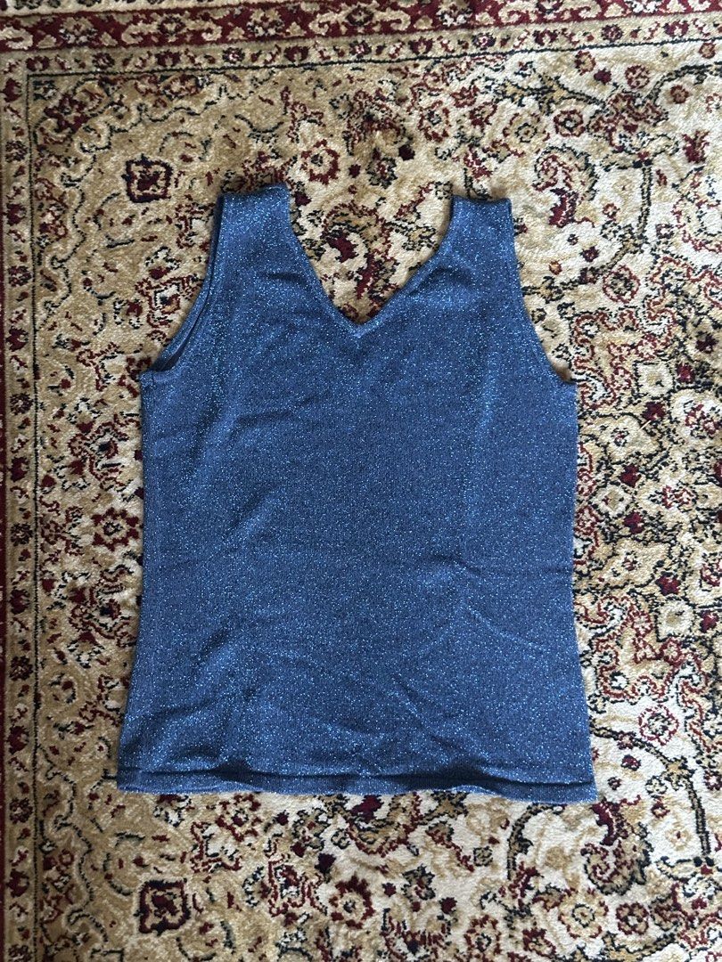 Blue Sparkly Tank Top XS/S (Category: Sleeveless) located in Quezon City. Submitted by guancialebaby (Listing ID 1431894394, Image 2). Description: - never worn! - Shimmering blue V-neck tank top - Lightweight and slightly stretchy fabric - Sleeveless design - Ideal for warm weather or layering - Classic, simple cut.