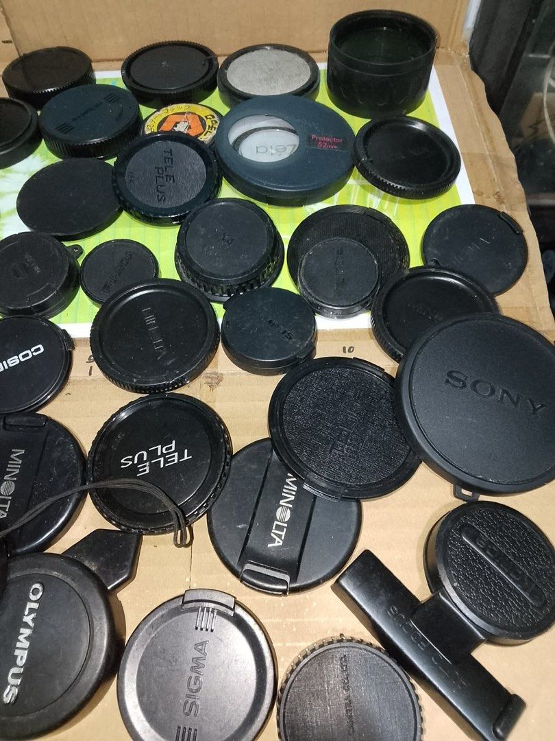 Camera Lens Caps Take All (Category: Cameras) located in Santo Tomas. Submitted by retrotastic (Listing ID 1431941908, Image 3). Description: vintage collection of mixed camera lens caps from brands like Olympus, Cosina, and Minolta, some front and some rear. As is. Different sizes and thickness ₱300 for all.