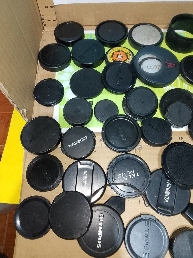 Camera Lens Caps Take All (Category: Cameras) located in Santo Tomas. Submitted by retrotastic (Listing ID 1431941908, Image 2). Description: vintage collection of mixed camera lens caps from brands like Olympus, Cosina, and Minolta, some front and some rear. As is. Different sizes and thickness ₱300 for all.