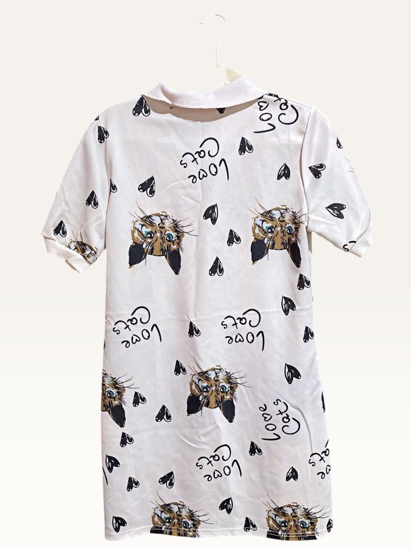 Cat Print White Dress (Category: Dresses) located in Manila. Submitted by marsmarvelous (Listing ID 1431951734, Image 2). Description: ✨SALE✨ Php 999 only!! Can fit S-M frame Perfect OOTD! - Cat print design with 'Love Cats' text - Collared neckline - Short sleeves - Lightweight fabric - Button-down front - Relaxed fit - Ideal for casual wear.