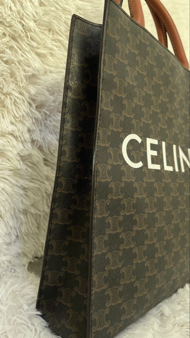 Celine Vertical Cabas Tote Bag (Category: Luxury Bags & Wallets) located in Muntinlupa City. Submitted by armendaber03743 (Listing ID 1431900546, Image 2). Description: Celine Vertical Cabas tote bag in brown. Features a brown leather handle and a detachable strap. The bag has a zipper closure and an interior pocket. The exterior features the Celine logo and pattern. The interior lining is a light brown color..