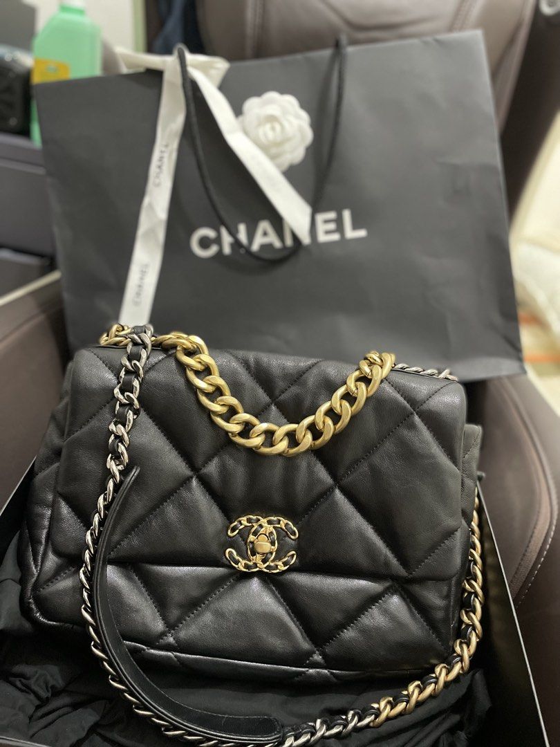 Chanel 19 Maxi Handbag Black (Category: Luxury Bags & Wallets) located in Caloocan City. Submitted by prelovedbymaria27 (Listing ID 1431907726, Image 3). Description: - Authentic Chanel 19 Maxi handbag - Black color - Diamond-quilted design - Gold and silver chain strap - Includes original Chanel box and dust bag - Approximately 13 inches in length.
