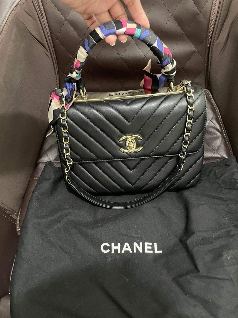 Chanel Chevron Top Handle Bag (Category: Luxury Bags & Wallets) located in Caloocan City. Submitted by prelovedbymaria27 (Listing ID 1431908744, Image 1). Description: - Authentic Chanel top handle bag - Black color - Gold-tone hardware - Chevron design - Chain strap - Includes a scarf - Comes with a Chanel dust bag.