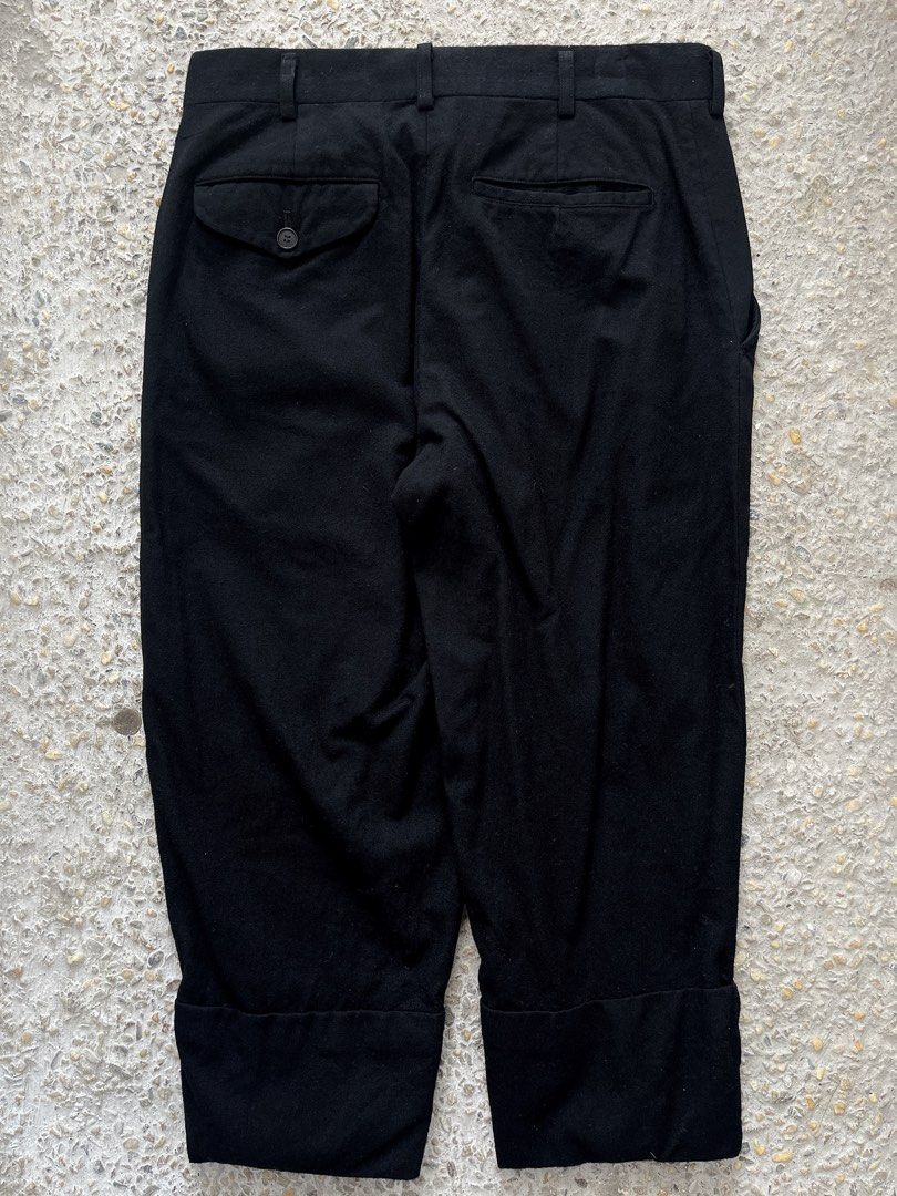 Comme Des Garçons Homme Plus FW’12 Wool Cropped Trousers (Category: Luxury Apparel) located in Dasmarinas. Submitted by bandananowheree (Listing ID 1431816164, Image 2). Description: Crafted from wool fabric with a pronounced drop-crotch silhouette. Features folded leg openings that enhance the drape and structure. From the Fall/Winter 2012 collection, a season defined by androgynous elegance fused with subtle punk sensibilities. A quiet but inte