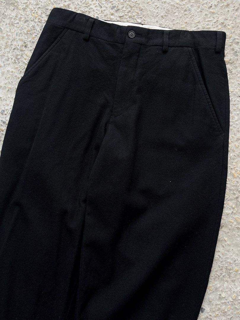 Comme Des Garçons Homme Plus FW’12 Wool Cropped Trousers (Category: Luxury Apparel) located in Dasmarinas. Submitted by bandananowheree (Listing ID 1431816164, Image 3). Description: Crafted from wool fabric with a pronounced drop-crotch silhouette. Features folded leg openings that enhance the drape and structure. From the Fall/Winter 2012 collection, a season defined by androgynous elegance fused with subtle punk sensibilities. A quiet but inte