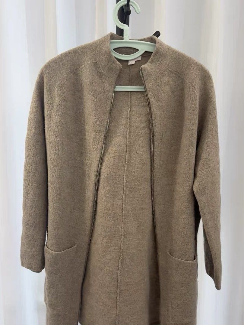 COS 100% Merino Wool Zip-Up Coat (Category: Coats, Jackets and Outerwear) located in Pasig City. Submitted by jamcy31 (Listing ID 1431856864, Image 3). Description: - COS wool coat, size XS, would best fit XS-S - Features a zip closure - Two front pockets - Stand-up collar - Made of 100% merino wool - Neutral color Used once then stored. This is great because it’s 100% wool and seems so light and thin but actually insulates warmth well!.