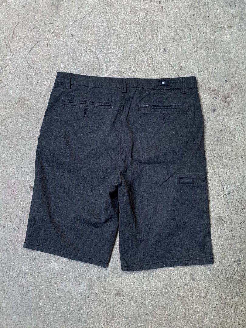 DC Shoes Relaxed Fit Shorts (Category: Shorts) located in Roxas City. Submitted by vaultcultureco. (Listing ID 1431975731, Image 3). Description: - DC Shoes relaxed fit shorts - Dark grey color - Size 34/34 - Button closure - Multiple pockets - DC Shoes logo - Made in Cambodia - Relaxed fit - Designed in the USA - Suitable for casual wear.
