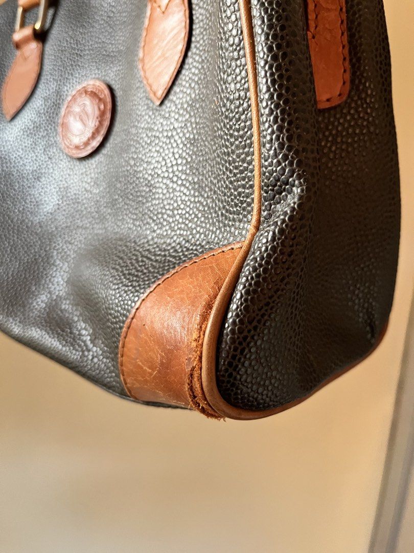 DELFINO DOCTORS BAG (Category: Luxury Bags & Wallets) located in Mandaluyong City. Submitted by chmrxx (Listing ID 1431852920, Image 3). Description: - Vintage Delfino handbag - Black textured body - Brown leather accents - Top zipper closure - Dual top handles - Interior zippered pocket - Shows wear on handles and corners.