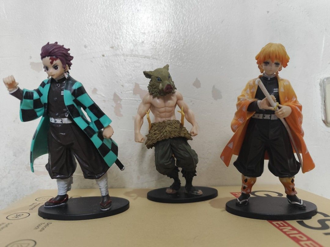Demon Slayer Anime Figures Set (Category: Figurines & Statues) located in Quezon City. Submitted by melsc (Listing ID 1431795666, Image 1). Description: Bundle of 3 Needs cleaning RFS: funds - Demon Slayer figurine set featuring Tanjiro Kamado, Inosuke Hashibira, and Zenitsu Agatsuma. - Each figure is highly detailed. - Figures are posed on a black base. - Perfect for Demon Slayer fans and collectors..