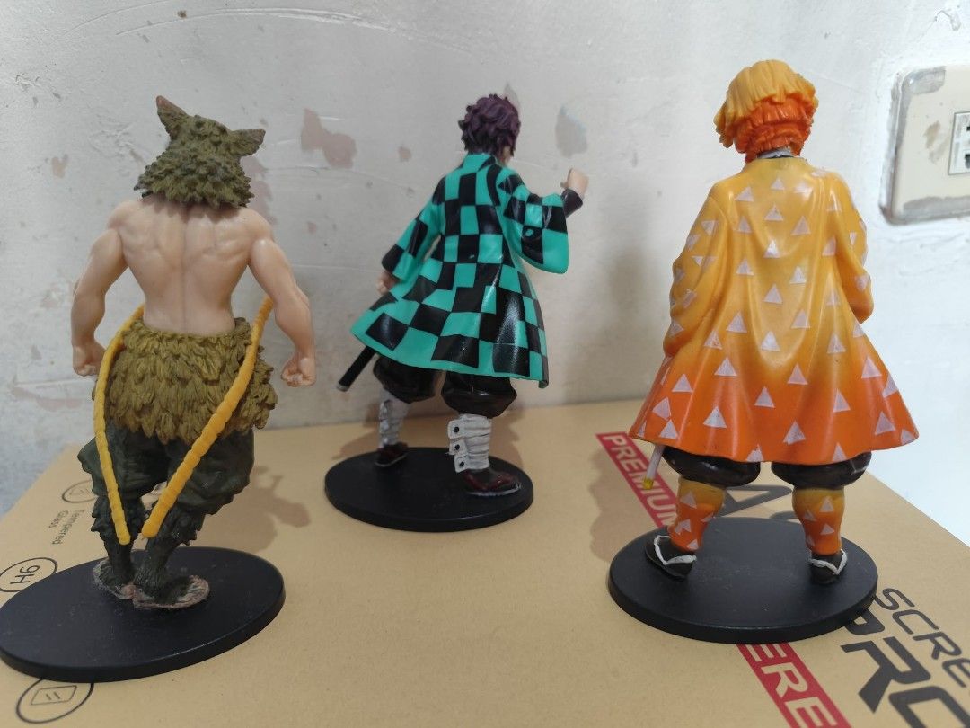 Demon Slayer Anime Figures Set (Category: Figurines & Statues) located in Quezon City. Submitted by melsc (Listing ID 1431795666, Image 2). Description: Bundle of 3 Needs cleaning RFS: funds - Demon Slayer figurine set featuring Tanjiro Kamado, Inosuke Hashibira, and Zenitsu Agatsuma. - Each figure is highly detailed. - Figures are posed on a black base. - Perfect for Demon Slayer fans and collectors..