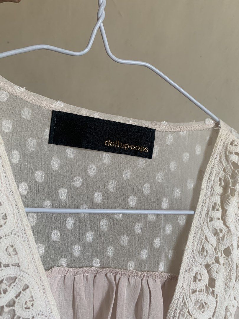 dollupoops beige pink lace and polka dot whimsy top (Category: Blouses) located in Pasay City. Submitted by nicnacks (Listing ID 1431873711, Image 3). Description: - Dollupoops blouse - Delicate lace neckline - Polka dot sleeves - Light pink ruffled bodice - V-neck design - Button closure - Flowy, lightweight fabric - Perfect for a feminine look.