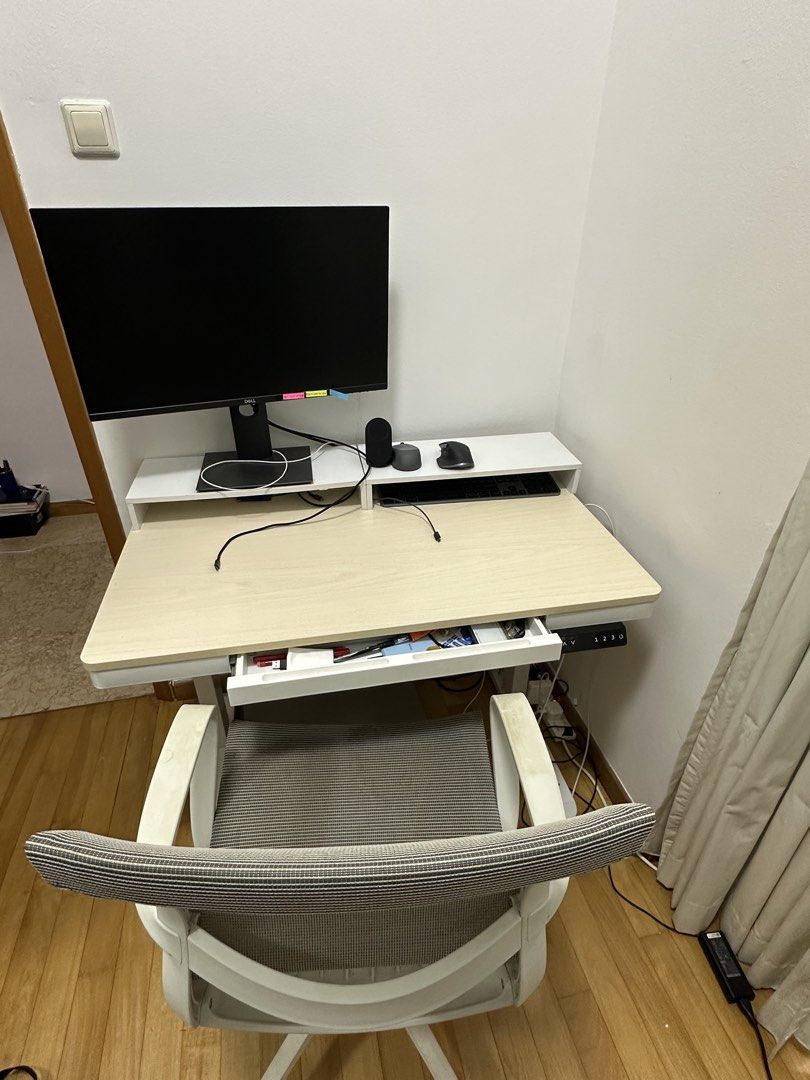 Electric standing desk and ergonomic chair set