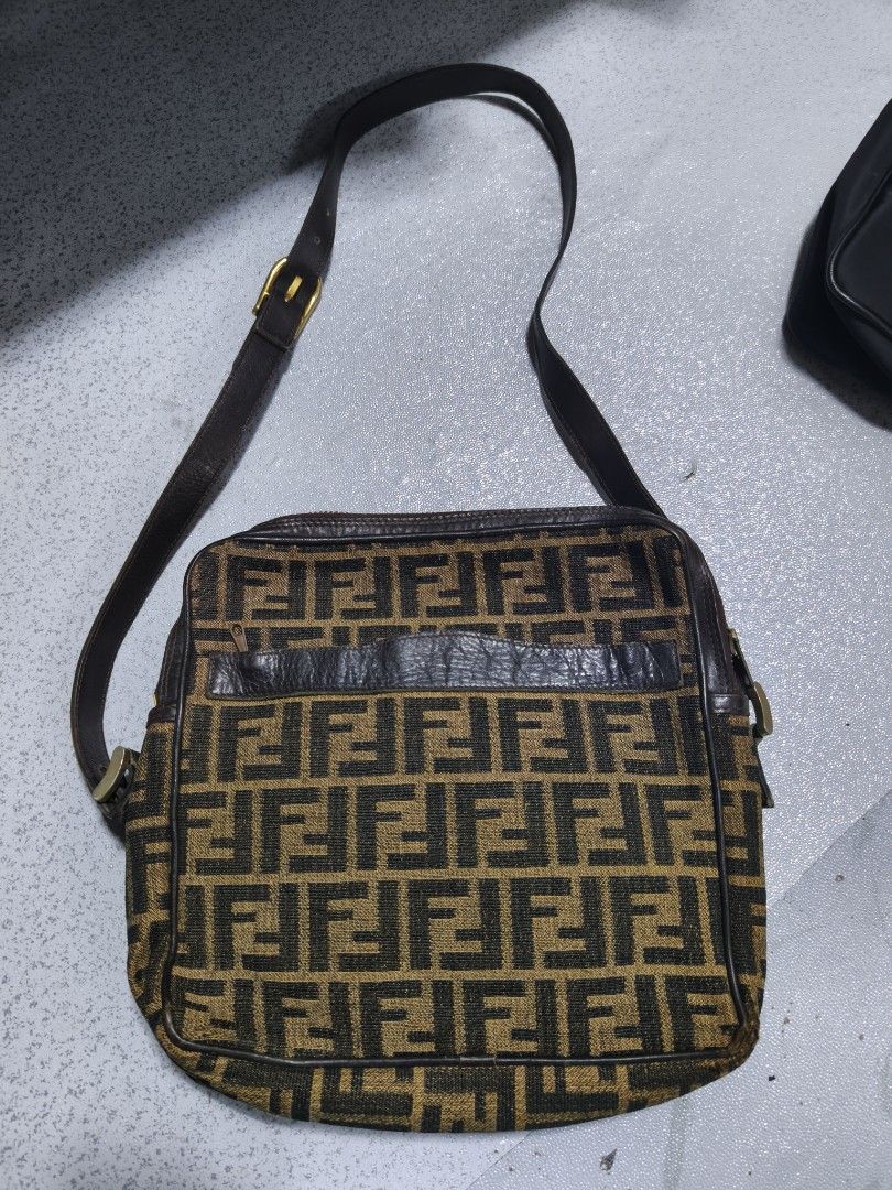 Fendi FF Logo Shoulder Bag (Category: Luxury Bags & Wallets) located in Davao. Submitted by navil01 (Listing ID 1431874899, Image 1). Description: - Authentic Fendi shoulder bag - Features the iconic FF logo pattern - Brown leather strap and trim - Interior includes a small pocket - Made in Italy.
