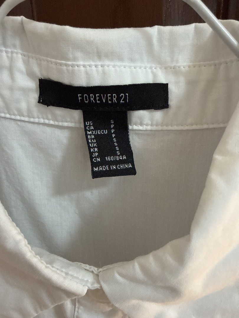 Forever 21 White Dress - Size S (Category: Dresses) located in Bulacan. Submitted by tidycorner (Listing ID 1431883637, Image 2). Description: - Forever 21 white dress - Size: S - Features: - Collared neckline - Button-down front - Short puff sleeves .
