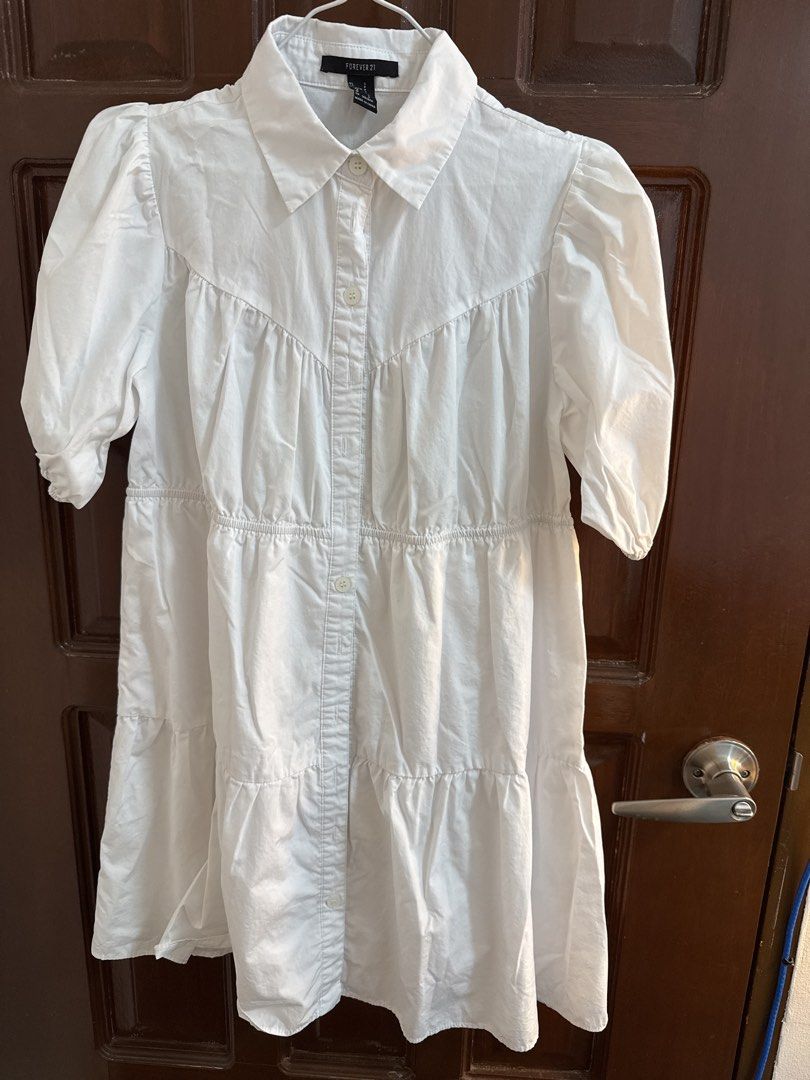 Forever 21 White Dress - Size S (Category: Dresses) located in Bulacan. Submitted by tidycorner (Listing ID 1431883637, Image 1). Description: - Forever 21 white dress - Size: S - Features: - Collared neckline - Button-down front - Short puff sleeves .