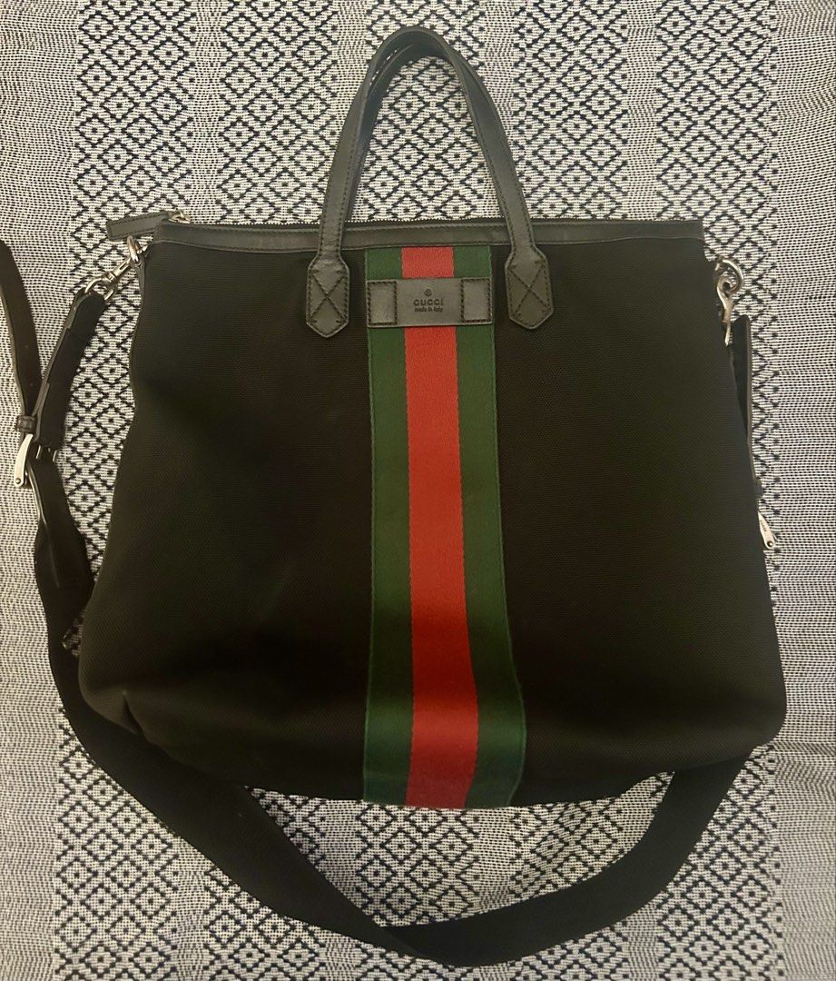 Gucci Web Stripe Tote Bag (Category: Luxury Bags & Wallets) located in Las Pinas. Submitted by tinamontec00246 (Listing ID 1431896209, Image 2). Description: GUCCI Web Stripe Nylon Tote (Black) • Authentic Gucci • Signature green-red web stripe • Durable nylon with leather trim • Top zip closure + detachable shoulder strap • Spacious everyday / travel tote ✨ Clean, minimal, and timeless Gucci piece ✨ Lightweight and very practical - Authentic Guc