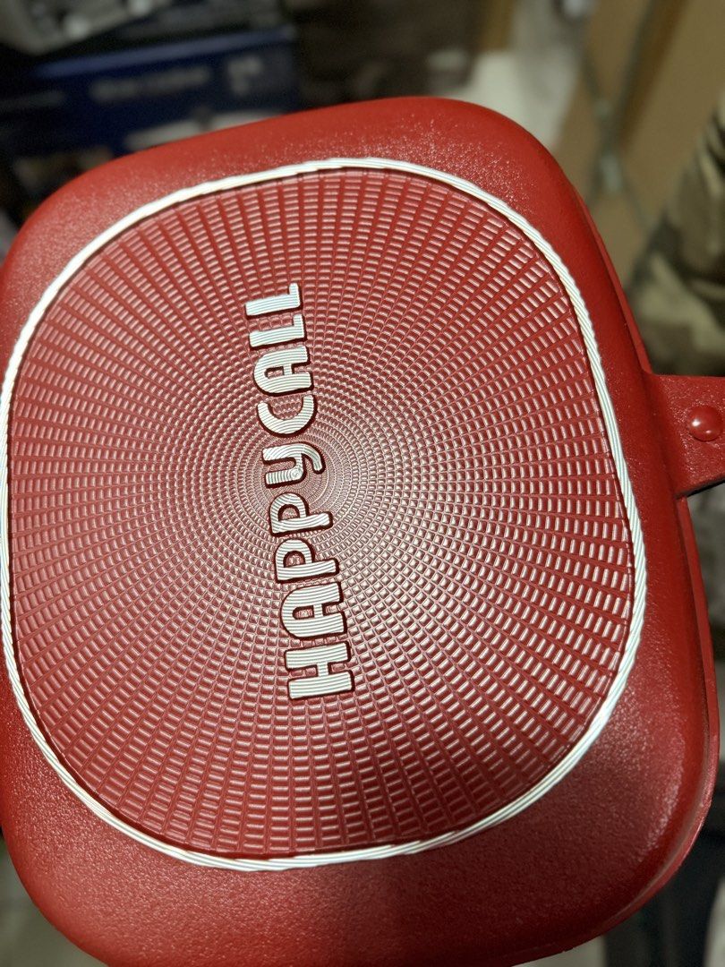 Happycall Double-Sided Grill Pan original (Category: Cookware & Accessories) located in Paranaque City. Submitted by homebox.com (Listing ID 1431870712, Image 1). Description: - Happycall double-sided grill pan - Red exterior - Non-stick interior - Double-sided design for even cooking - Comfortable handle - Includes silicone seal - Features a magnetic lock - Happycall logo visible.