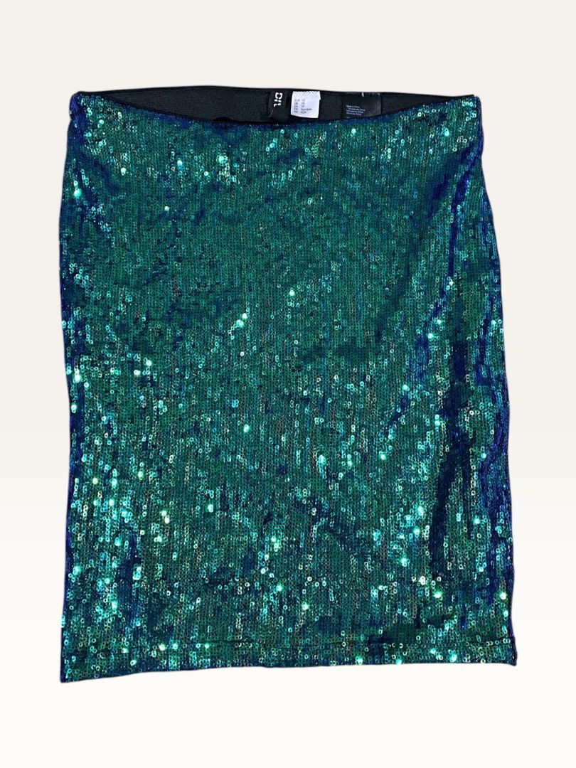 H&M Sequin Skirt and White Top Set (Category: Sets or Coordinates) located in Manila. Submitted by marsmarvelous (Listing ID 1431944008, Image 1). Description: ✨SALE✨ Php 249 only!! Used once only in SG for Taylor Swift concert! Perfect OOTD! - Green sequin skirt (size XS) with elastic waistband. - White top with sweetheart neckline and puff sleeves. (slightly discoloration on right off-shoulder - Medium on tag) - Ideal for special occasions or a