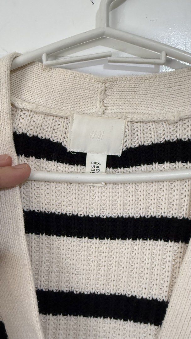 H&M Striped Cardigan - XL (Category: Coats, Jackets and Outerwear) located in Carmen. Submitted by vraorng (Listing ID 1431847737, Image 3). Description: - H&M striped cardigan - Color: Black and cream - Size: XL - Features: V-neck, button closure - Material: Knit - Perfect for layering Only used once for a trip Original H&M - Size XL Shipping from Bohol via J&T.