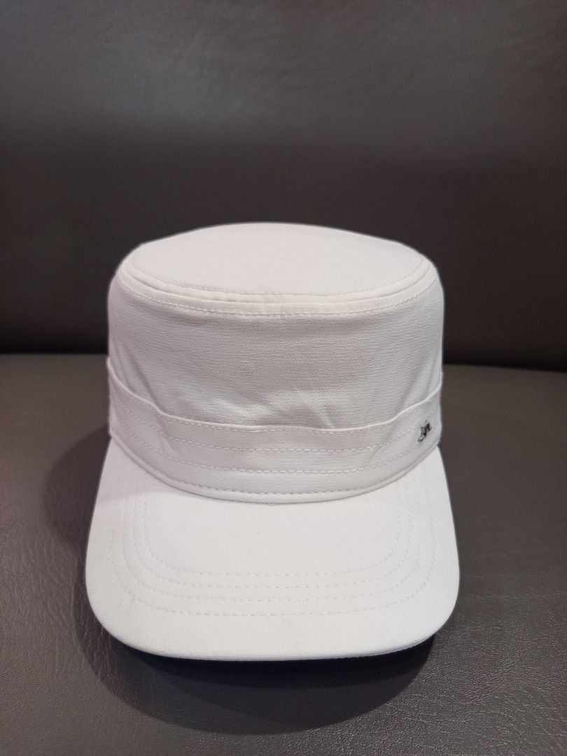 J. Lindeberg White Cap (Category: Caps & Hats) located in Davao. Submitted by vaness041421 (Listing ID 1431961413, Image 2). Description: - J. Lindeberg white cap - Features a flat brim and structured crown - Brand logo on the side - Interior lining with brand name - Made of smooth, possibly synthetic material - Clean, minimalist design.