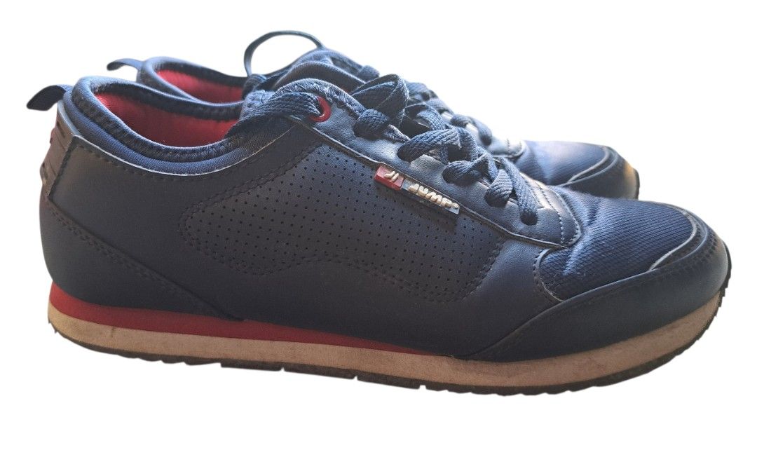 Jump Style Navy Blue Sneakers (Category: Sneakers) located in Caloocan City. Submitted by coolhearty_things (Listing ID 1431855458, Image 3). Description: Navy blue Jump Style sneakers. Features red accents on the inner lining and laces. The shoes have a cushioned sole with a white and red trim. The size is 38. The shoes have a lace-up closure and a padded tongue. The Jump Style logo is visible on the side of the shoe..