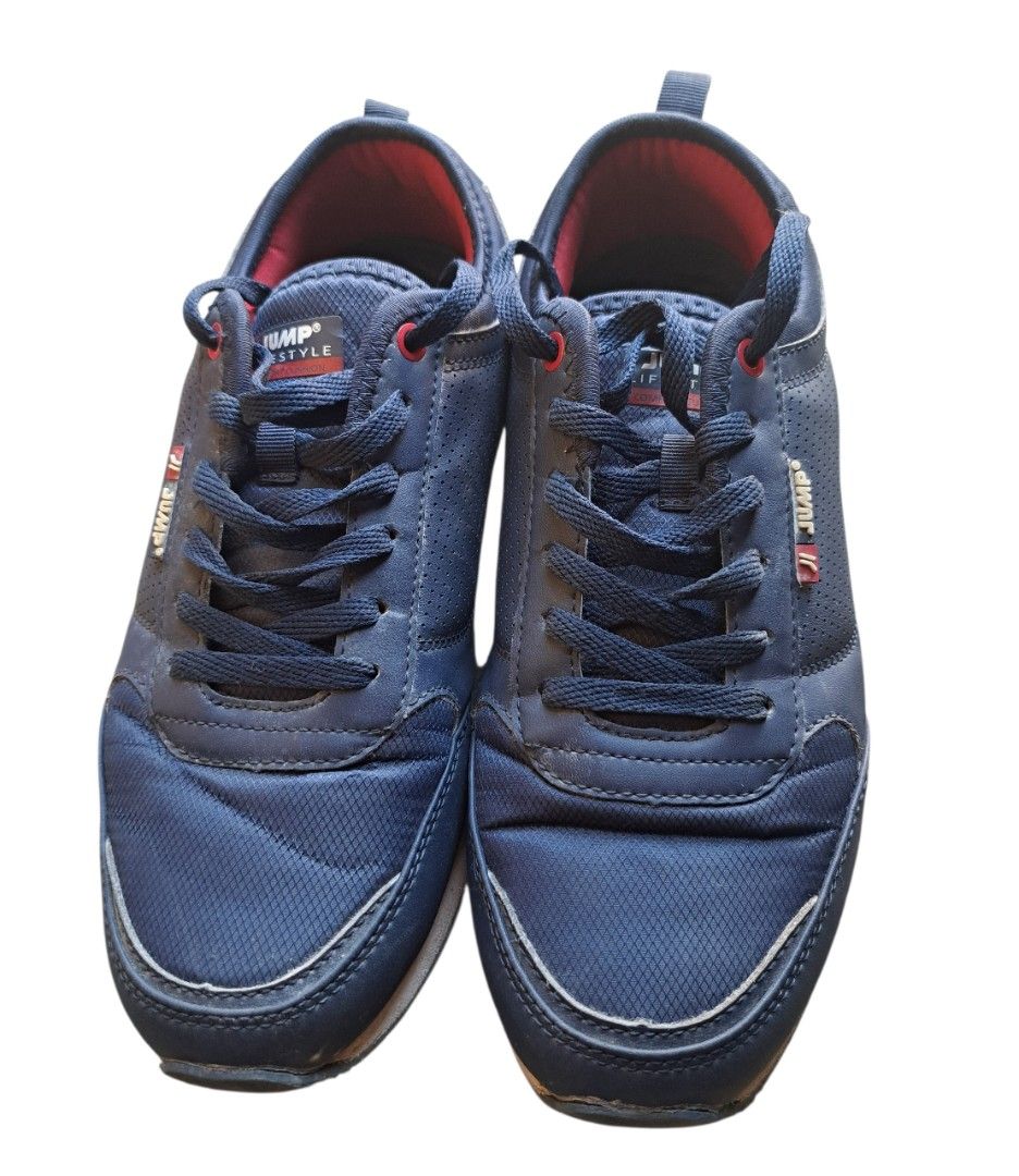 Jump Style Navy Blue Sneakers (Category: Sneakers) located in Caloocan City. Submitted by coolhearty_things (Listing ID 1431855458, Image 1). Description: Navy blue Jump Style sneakers. Features red accents on the inner lining and laces. The shoes have a cushioned sole with a white and red trim. The size is 38. The shoes have a lace-up closure and a padded tongue. The Jump Style logo is visible on the side of the shoe..