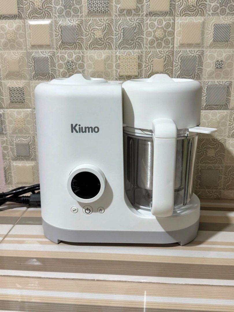 Kiumo Baby Food Processor (Category: Weaning & Toddler Feeding) located in Imus. Submitted by pacific.mermaids (Listing ID 1431925198, Image 1). Description: - Multifunctional: Steam, blend, sterilize, and warm baby food. - Powerful: 300W steam function, 120W blend function. - Safe Materials: Made with 304 stainless steel and Tritan/PP. - Child-Safe: Features child safety locks. - Easy to Clean: Designed for convenient cleaning. - Large Capacity: