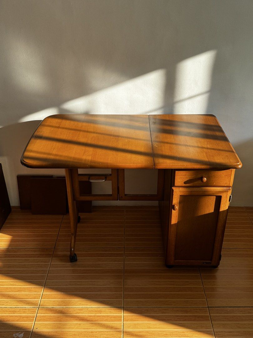 KOIZUMI Wood extendable collapsible table with wheels (Category: Tables & Sets) located in San Juan City. Submitted by anca.shoppes (Listing ID 1431885722, Image 1). Description: KOIZUMI H26.5" W23" L38" Study table, Work/Office table, Sewing Table, Side table Collapsible, Expandable, Foldable Midcentury, vintage table Bought from Japan Surplus for ₱7,000 Signs of use (scratches, discoloration, etc), missing 1-2 screws.