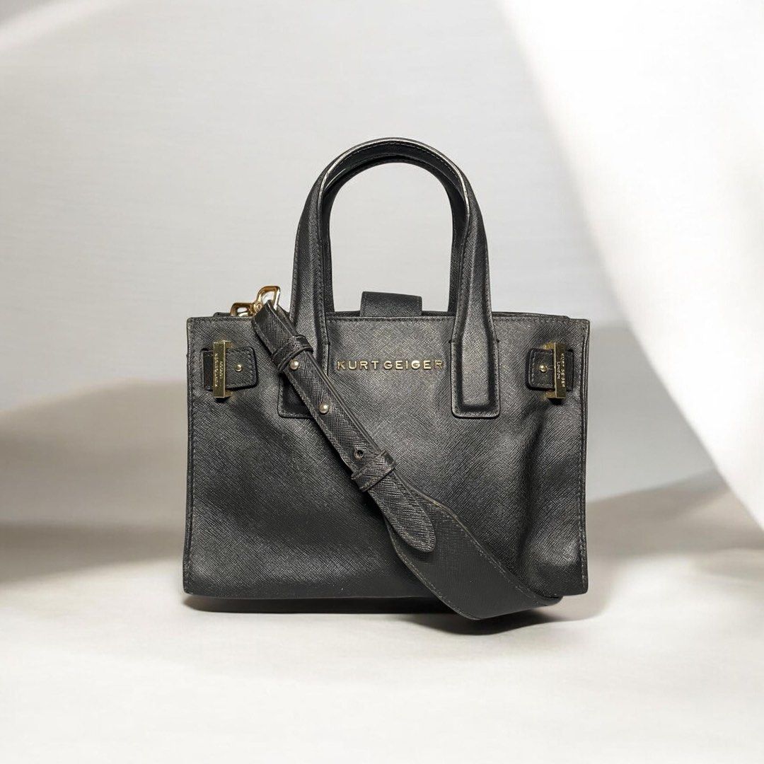 KURT GEIGER crossbody bag (Category: Luxury Bags & Wallets) located in Bulacan. Submitted by theclosetsale.ph (Listing ID 1431788240, Image 1). Description: KURT GEIGER bag in SAFFIANO leather -size small -gold hardwares -can be worn as handbag - crossbody leather strap included -great condition -can fit long wallet, small umbrella, iphone 17pro max -pre-love but well taken cared of Retails at $200 and up Selling low just DM me✨.