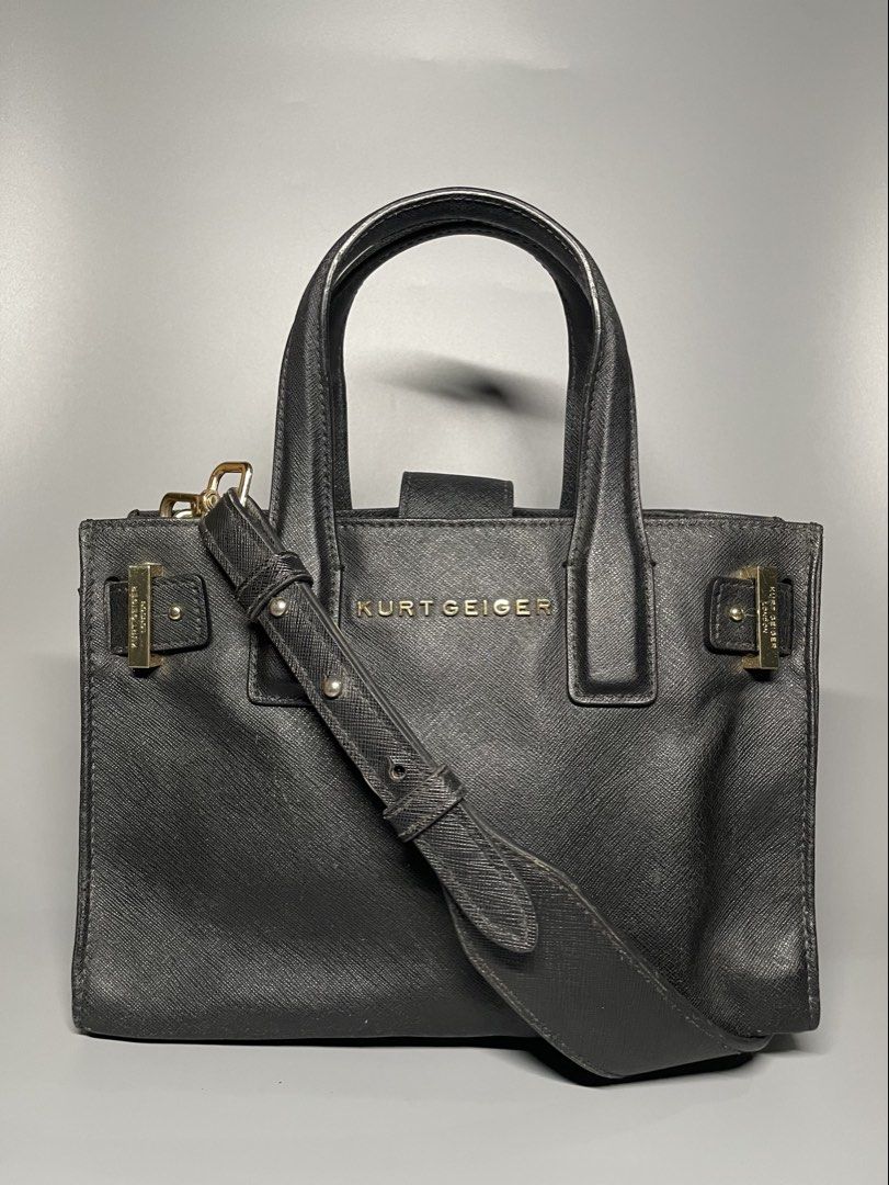 KURT GEIGER crossbody bag (Category: Luxury Bags & Wallets) located in Bulacan. Submitted by theclosetsale.ph (Listing ID 1431788240, Image 2). Description: KURT GEIGER bag in SAFFIANO leather -size small -gold hardwares -can be worn as handbag - crossbody leather strap included -great condition -can fit long wallet, small umbrella, iphone 17pro max -pre-love but well taken cared of Retails at $200 and up Selling low just DM me✨.