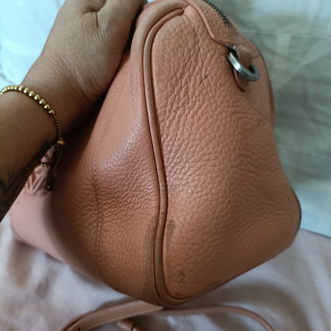 Loewe Amazona Handbag (Category: Luxury Bags & Wallets) located in Cainta. Submitted by prelovedbags06 (Listing ID 1431806054, Image 2). Description: - Authentic Loewe Amazona handbag - Beautiful peach color - Top handle with braided detail - Detachable shoulder strap - Zip closure - Fabric interior - Embossed Loewe logo - Made in Spain -See picture for the issue...