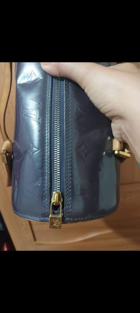 Louis Vuitton Vernis Cylinder Bag (Category: Luxury Bags & Wallets) located in Pasig City. Submitted by aubshop (Listing ID 1431929425, Image 2). Description: - Authentic Louis Vuitton Vernis Cylinder Bag - Color: Dark Blue - Features: Zip closure with gold-tone zipper pull, tan leather handles and trim - Interior: Matching dark blue - Serial Number: V10035.