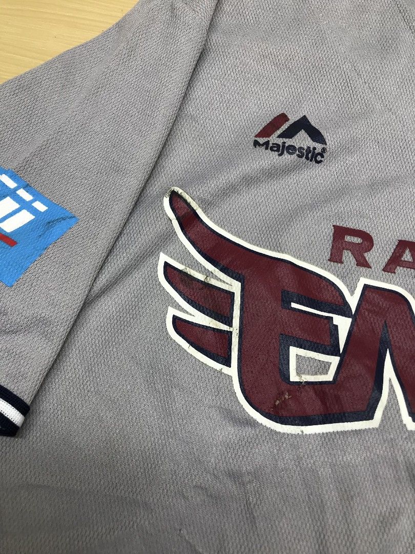 Majestic Rakuten Eagles Baseball Jersey (Category: Tshirts & Polo Shirts ) located in Manila. Submitted by hitsforfits (Listing ID 1431981822, Image 3). Description: • Rakuten Eagles Gray Baseball Jersey 📏 Size: M 📏 Dimes: 21 x 26.5 ₱ 299 - Gray Rakuten Eagles baseball jersey - Brand: Majestic - Features team name and logo on the front - Includes Fuji logo on the sleeve - Button-up closure - Short sleeves with white and navy trim - Visible tag 