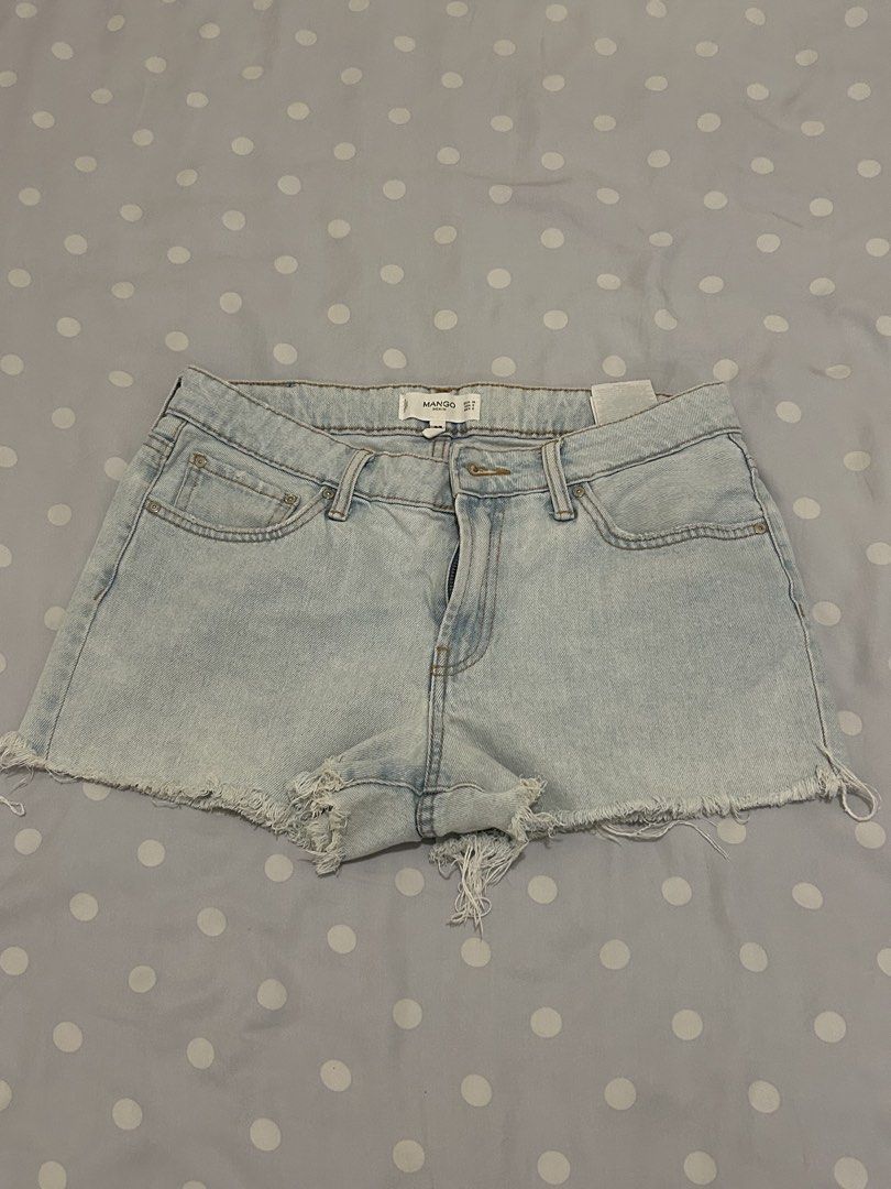 Mango Denim Shorts (Category: Shorts) located in Quezon City. Submitted by bea30 (Listing ID 1431955993, Image 1). Description: - Mango denim shorts - Light wash - Size US 6 (M) - Light blue color - Raw hem - Classic five-pocket design - Button and zipper closure - No flaws, just decluttering.
