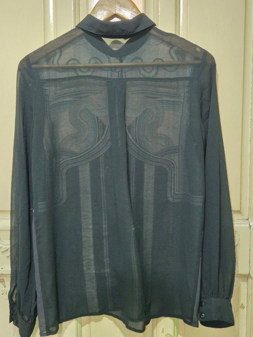 Miss Selfridge Sheer long-sleeved blouse (Category: Longsleeves) located in Quezon City. Submitted by redragtag (Listing ID 1431864478, Image 2). Description: Long-sleeved blouse featuring a unique geometric and curved print in pastel shades. A black sheer button-up shirt woth pointed collar, ling sleeves with buttoned cuffs. Lightweight fabric, concealed button placket design. Lightly used. No damage..