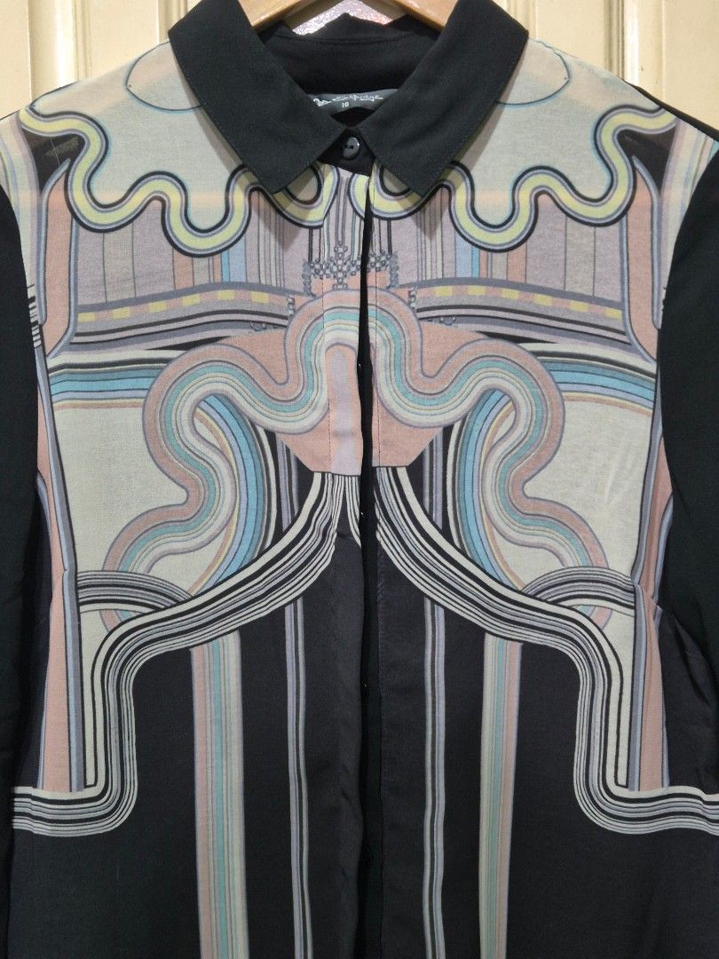 Miss Selfridge Sheer long-sleeved blouse (Category: Longsleeves) located in Quezon City. Submitted by redragtag (Listing ID 1431864478, Image 3). Description: Long-sleeved blouse featuring a unique geometric and curved print in pastel shades. A black sheer button-up shirt woth pointed collar, ling sleeves with buttoned cuffs. Lightweight fabric, concealed button placket design. Lightly used. No damage..