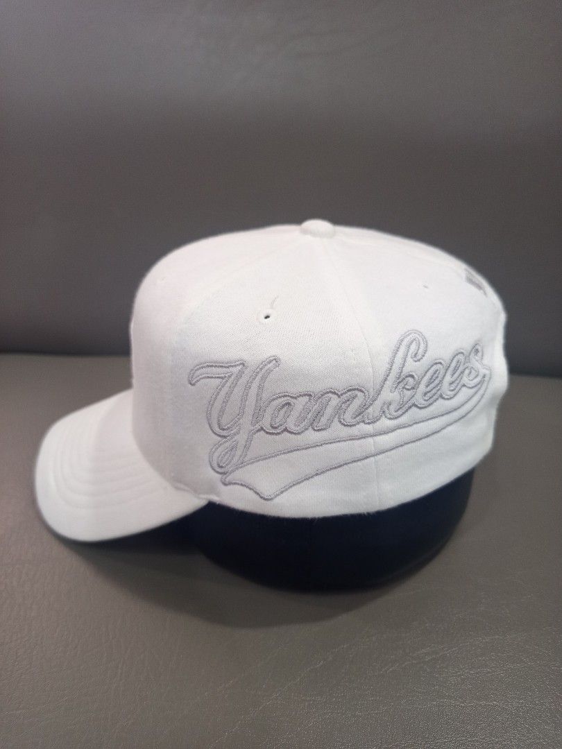 MLB New York Yankees Cap (Category: Caps & Hats) located in Davao. Submitted by vaness041421 (Listing ID 1431961457, Image 1). Description: - Official New York Yankees cap. - Features the iconic Yankees logo. - "Yankees" wordmark on the side. - Adjustable strap for a comfortable fit. - MLB logo buckle. - Includes MLB and Major League Baseball tags. - Made of a sturdy, durable material..