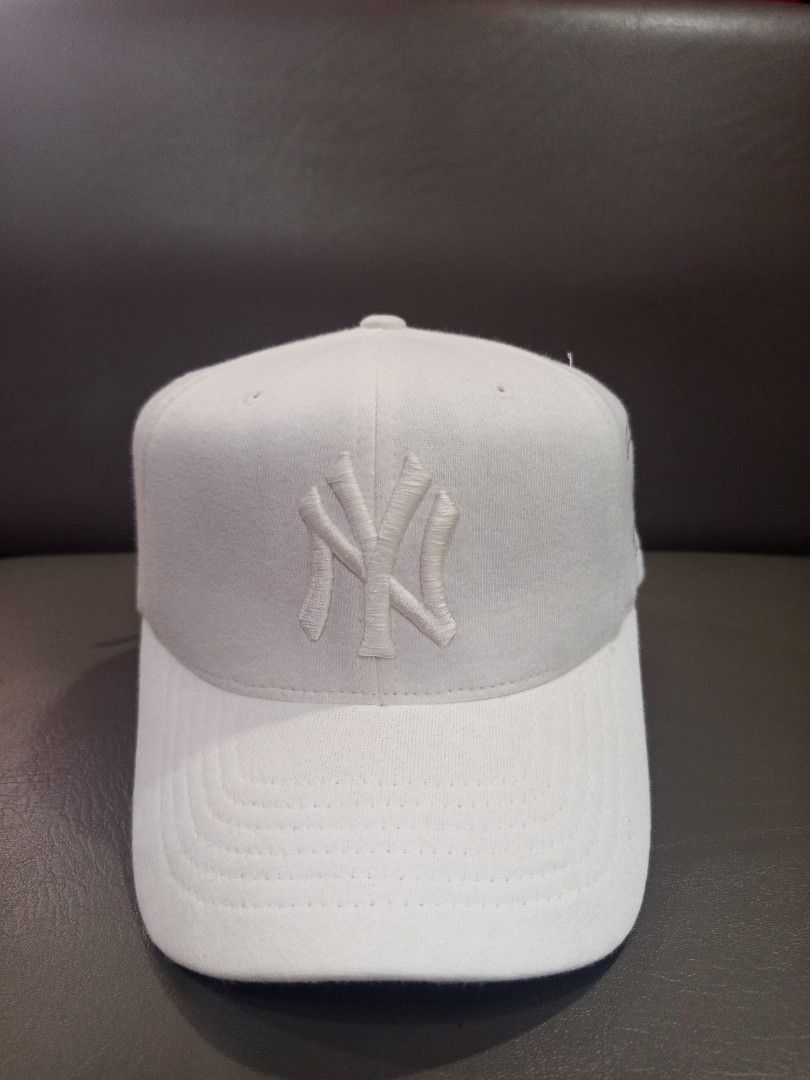 MLB New York Yankees Cap (Category: Caps & Hats) located in Davao. Submitted by vaness041421 (Listing ID 1431961457, Image 2). Description: - Official New York Yankees cap. - Features the iconic Yankees logo. - "Yankees" wordmark on the side. - Adjustable strap for a comfortable fit. - MLB logo buckle. - Includes MLB and Major League Baseball tags. - Made of a sturdy, durable material..